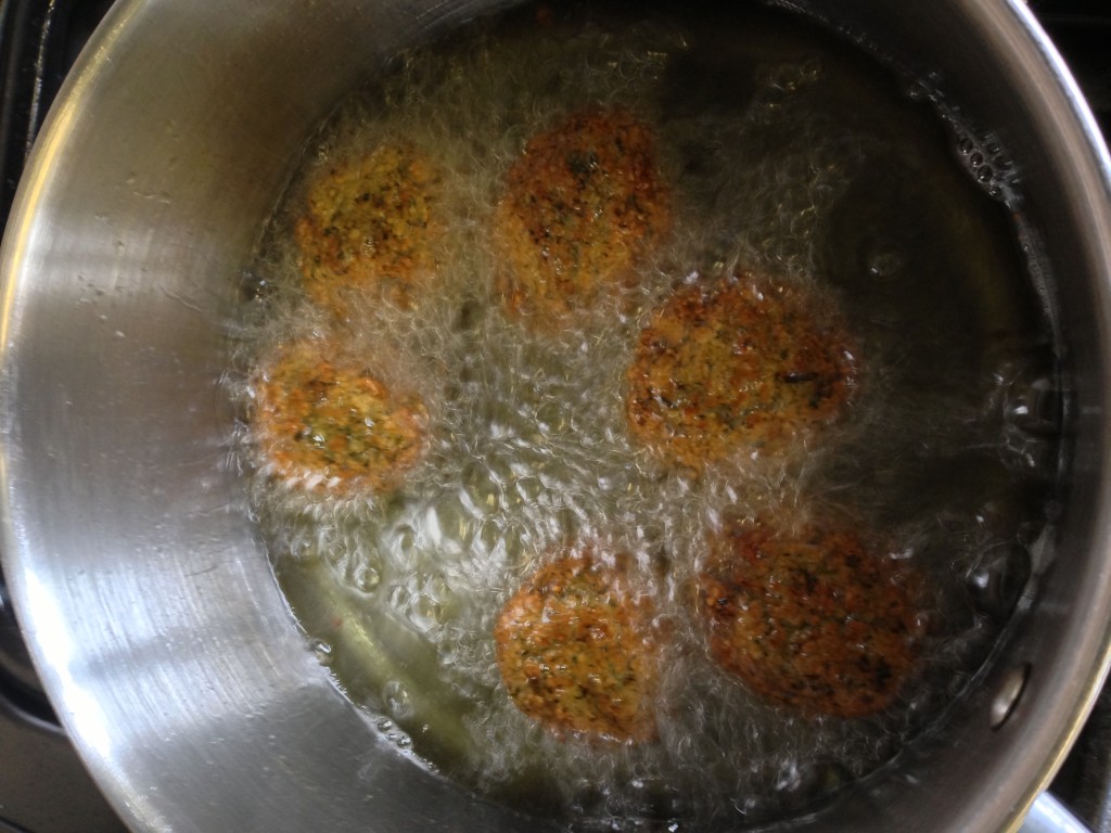 Turn falafel to finish frying